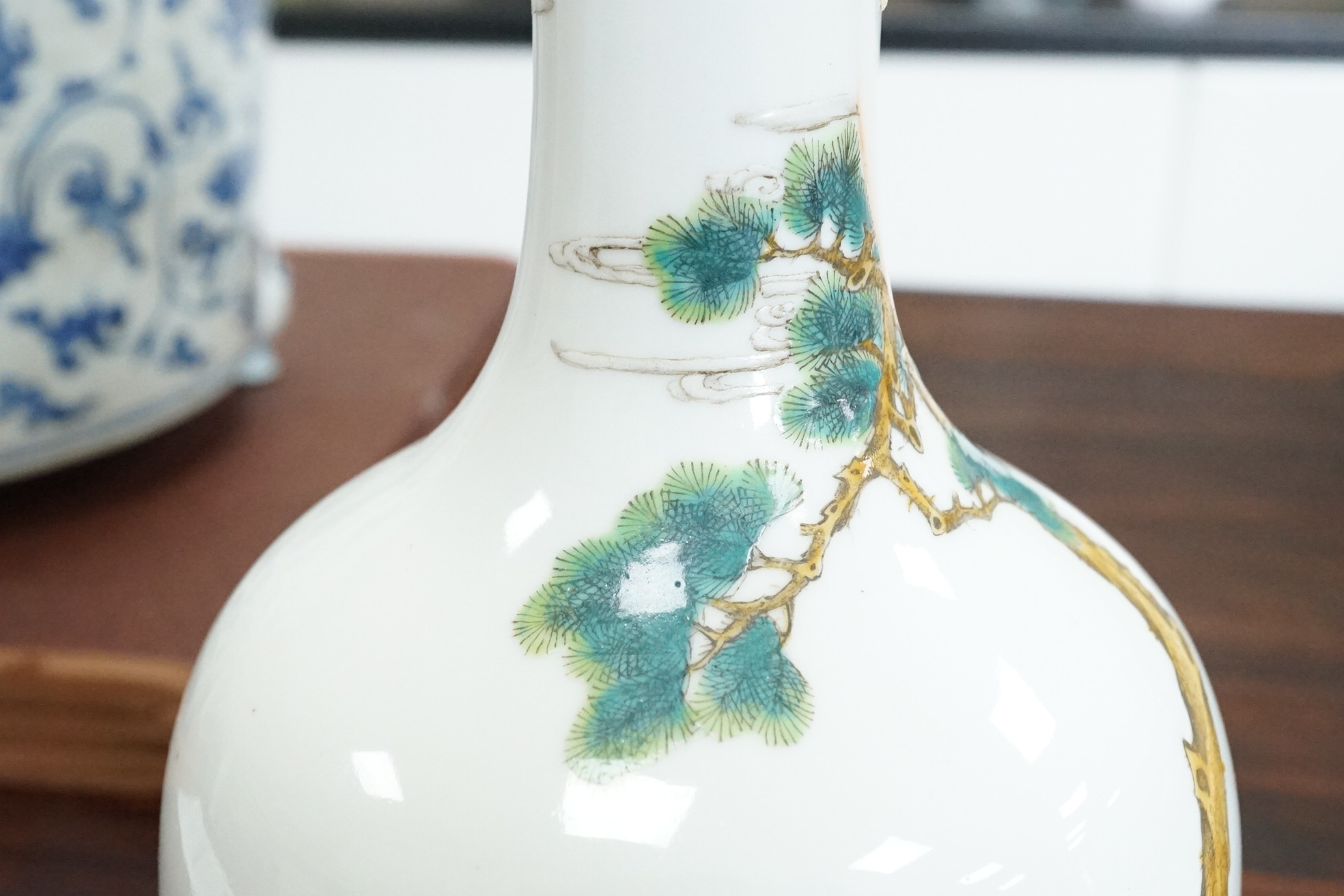 A Chinese famille rose ‘Liu Hai’ bottle vase, Qianlong six character seal mark but Republic period